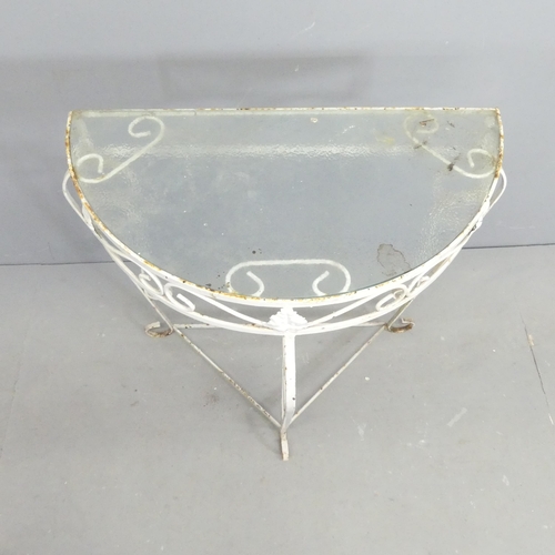 267 - A painted wrought metal demi-lune console table with inset glass top. 72x69x38cm.