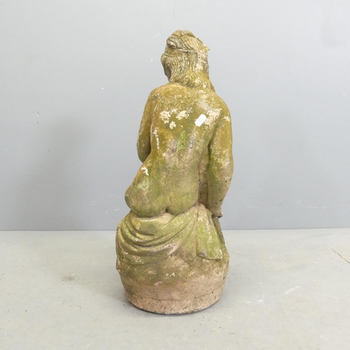 270 - A weathered stone garden statue, study of a nude seated lady. Height 59cm.