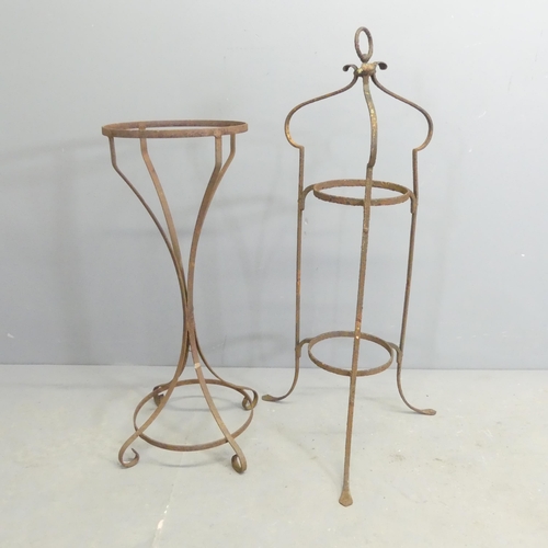 277 - Two cast iron plant stands. Tallest 86cm.