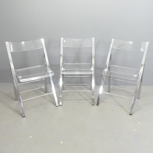 115 - Three contemporary folding chairs, with lucite seats on chrome frames.