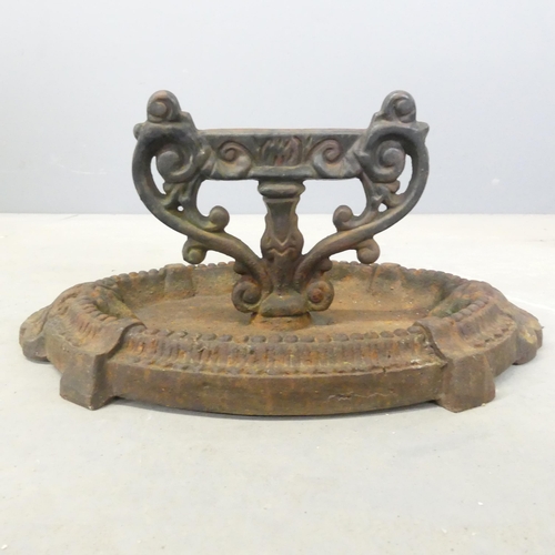 283 - An antique cast iron boot scraper. 36x17x24cm.