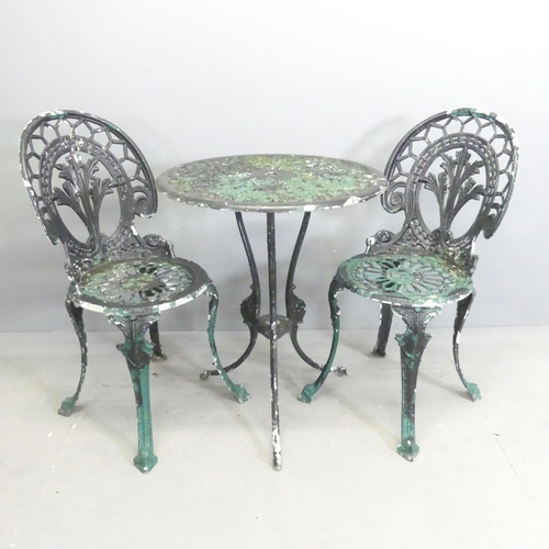 284 - A painted aluminium circular patio table, 60x73cm, with two matching chairs.