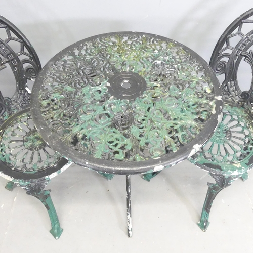 284 - A painted aluminium circular patio table, 60x73cm, with two matching chairs.