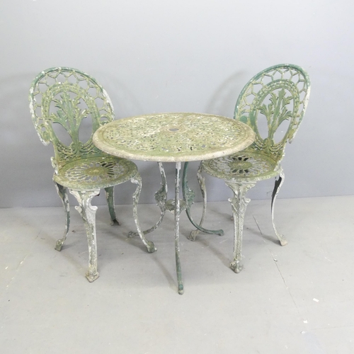 285 - A painted aluminium circular patio table, 69x64cm, and two matching chairs.