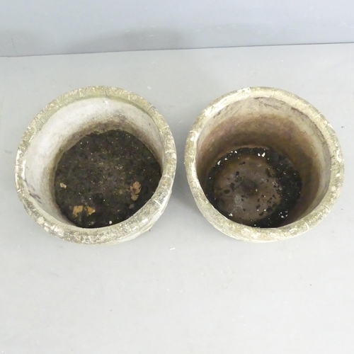 288 - A pair of circular concrete planters. 41x31cm.