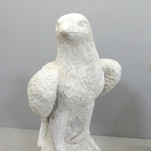 117 - A pair of modern composite garden statues, studies of Eagles. Height 60cm.