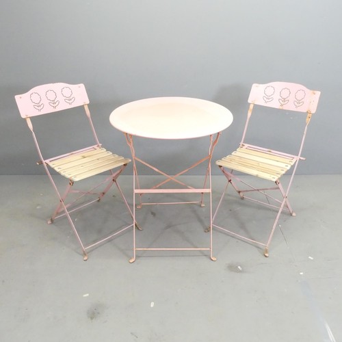 105 - A circular painted metal folding bistro table, 59x71cm, and two matching chairs.