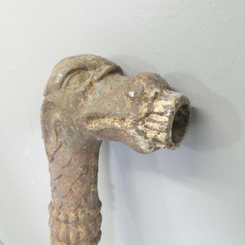 303 - A cast iron pipe, in the form of a dragon head. Height 86cm.