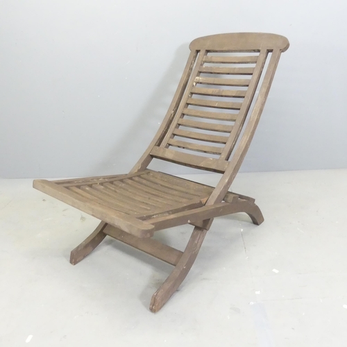 306 - A teak slatted folding sun lounger.