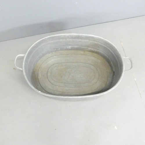 309 - A vintage galvanised wash basin. 85x30x50cm.