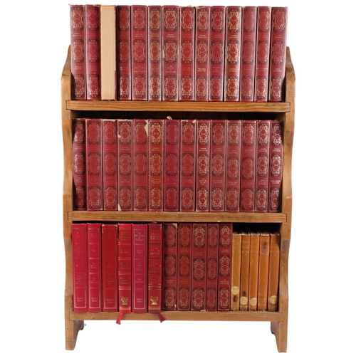 935 - A pine bookcase containing a collection of Dennis Wheatley books, distributed by Heron books, circa ... 