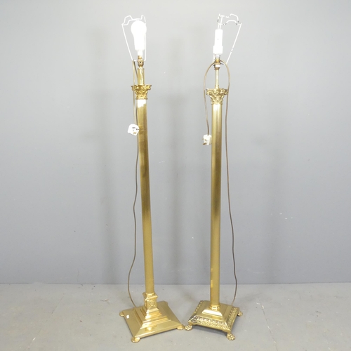 2575 - Two similar brass Corinthian column standard lamps. Tallest height to bayonet 142cm.