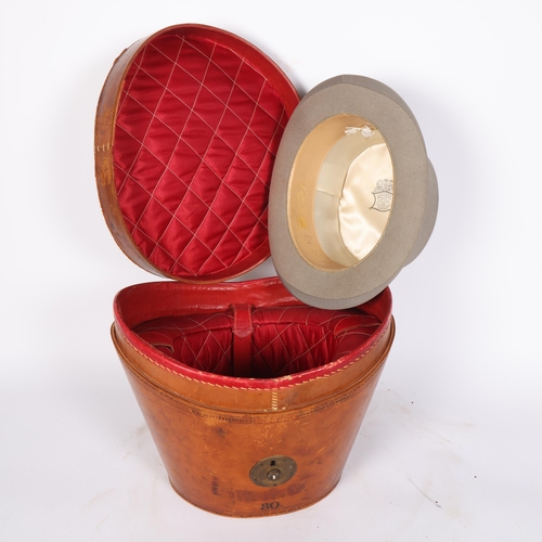 19 - A Victorian brown leather hat box and lid, by John Pound & Company, Leadenhall Street, with red silk... 