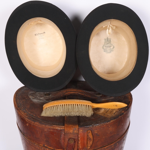 21 - A large Victorian brown leather double hat box, with silk-lined interior, together with 2 black top ... 