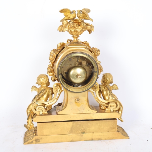 59 - An Antique French ormolu mantel clock, with a blue ceramic dial and black Roman numerals, with pendu... 