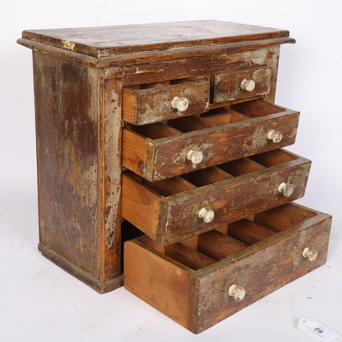 62 - A 19th century distressed pine table-top apprentice piece chest with 2 short and 3 long drawers, 40c... 