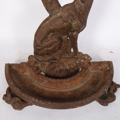 63 - A Victorian cast-iron stick stand, with dog and foliate support, H72cm