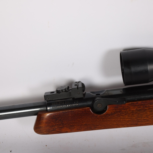 69 - WEBLEY & SCOTT LTD - an Osprey .22 air rifle with a Bisley scope, L109cm, and soft carry case