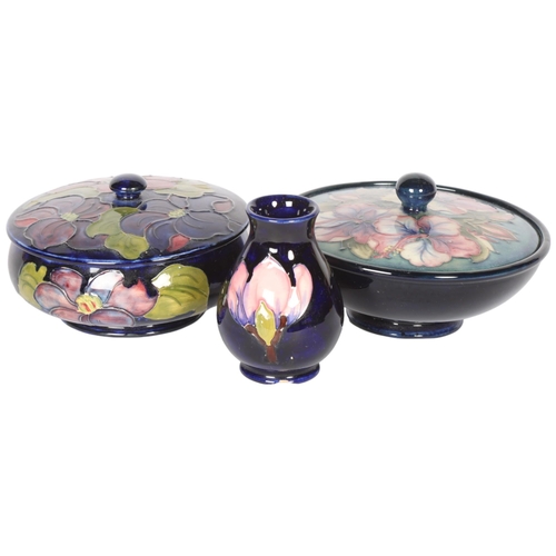 225 - MOORCROFT -  3 pieces of blue ground tube-lined Moorcroft, including 2 powder bowls and cover, and a... 