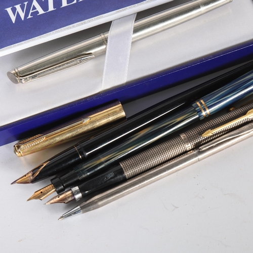 251 - A group of various pens, including a boxed Waterman, a Canadian Lucky Curve fountain pen with gold n... 