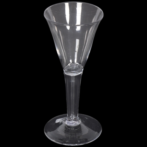 261 - An 18th century moulded wine glass, of conical tapered form, H15.5cm