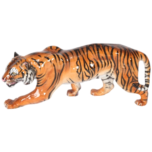 262 - ROYAL DOULTON - a large ceramic study of a prowling tiger, L34cm, HN2646