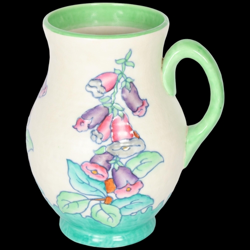 263 - CHARLOTTE REED for CROWN DUCAL - a ribbed jug in Foxglove pattern, no. 4953, H21.5cm