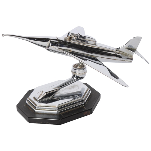 265 - A Vintage chrome plate table lighter in the form of a jet aeroplane on stand