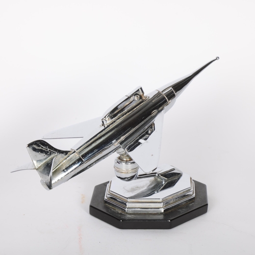 265 - A Vintage chrome plate table lighter in the form of a jet aeroplane on stand