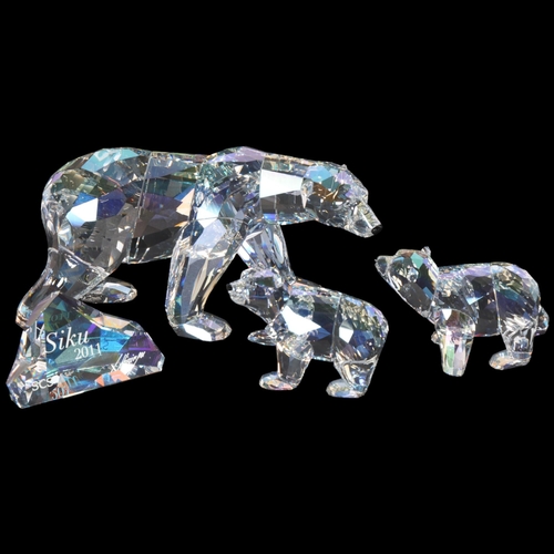 267 - A Swarovski Siku polar bear, L15.5cm, together with 2 cubs and rock marked Siku to 2011, (4)