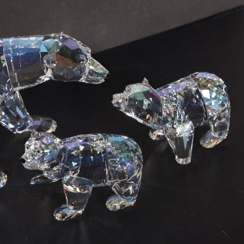 267 - A Swarovski Siku polar bear, L15.5cm, together with 2 cubs and rock marked Siku to 2011, (4)