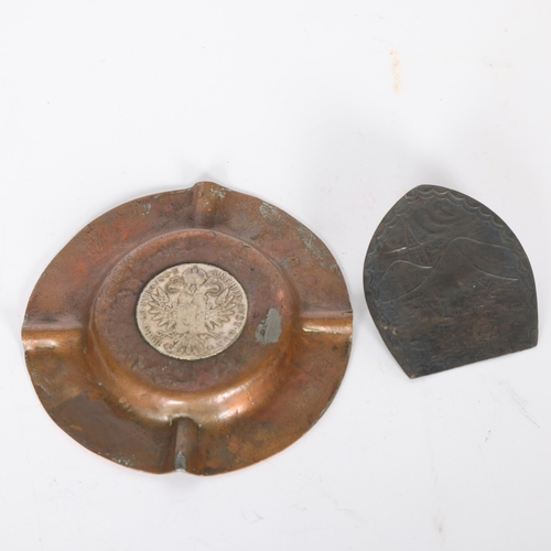 269 - A copper ashtray with an inset Maria Theresa thaler silver coin, and a horseshoe design letter clip ... 