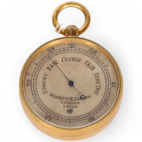 271 - NEGRETTI & ZAMBRA - a gilt-metal pocket barometer, serial no. 29506, diameter 5cm