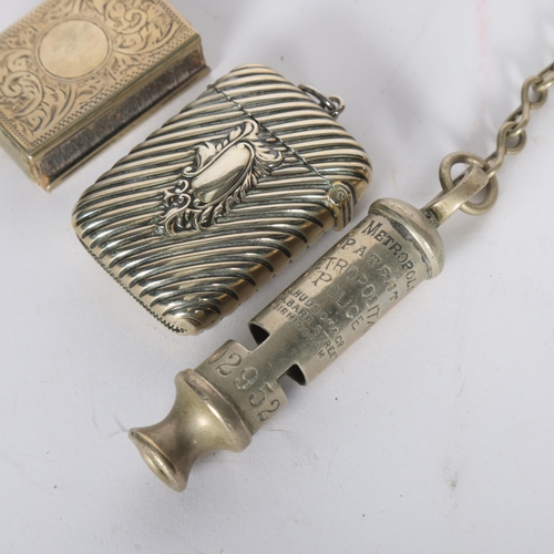 273 - Items to include the Metropolitan Police whistle, a chrome plated Vesta and matchbox cover (3)