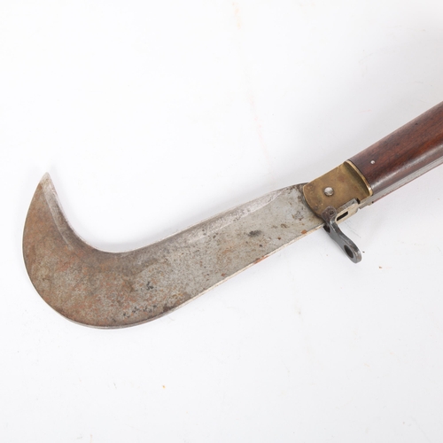 285 - A 19th century Whitby thatcher's folding knife, with brass mounts and rosewood handle, length 31cm