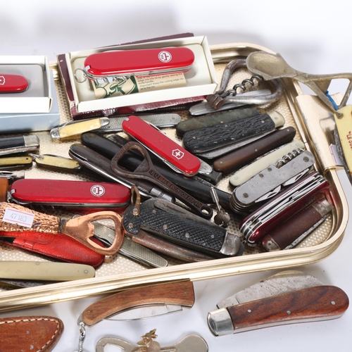 292 - A large collection of mixed Vintage and other penknives, bowie type knife, corkscrews, etc