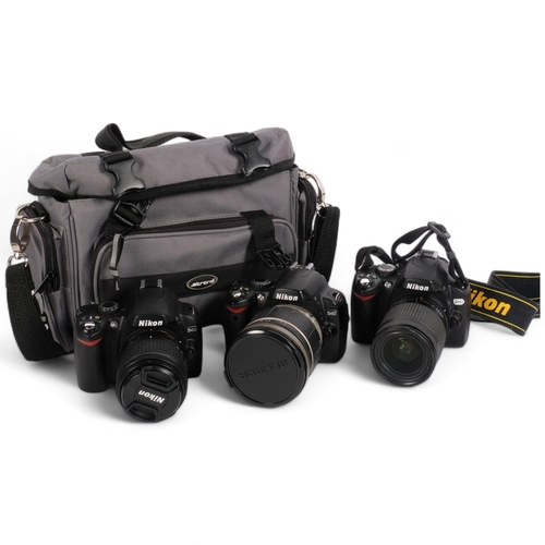 322 - A Nikon D60 digital camera, with associated Nikkor 28mm lens, a Nikon D40 digital camera, with assoc... 