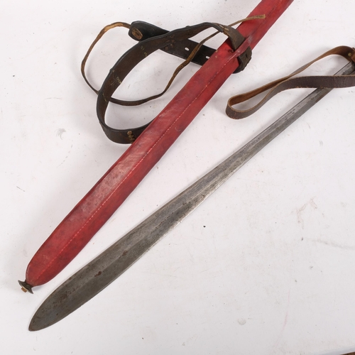 348 - A flat bladed Indian sword, with associated sheath covering, L75cm, unmarked