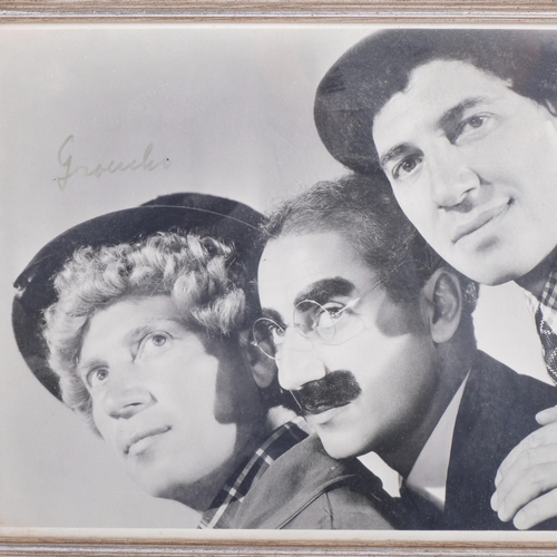 116 - 2 signed black and white photographs, Tommy Cooper and Groucho, both framed