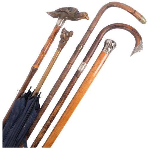 123 - A group of various canes and walking sticks, including parasol with a carved French Bulldog head and... 