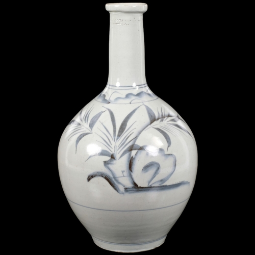 175 - A 19th century Japanese sake bottle vase, blue and white floral decoration, H27.5cm