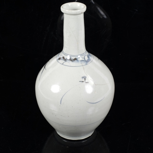 175 - A 19th century Japanese sake bottle vase, blue and white floral decoration, H27.5cm