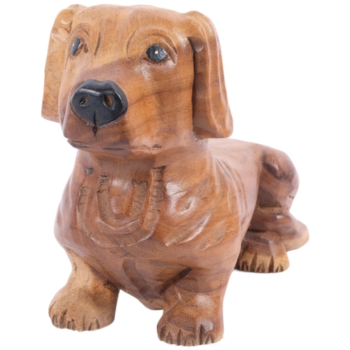 181 - A carved softwood study of a short legged dog, L36cm