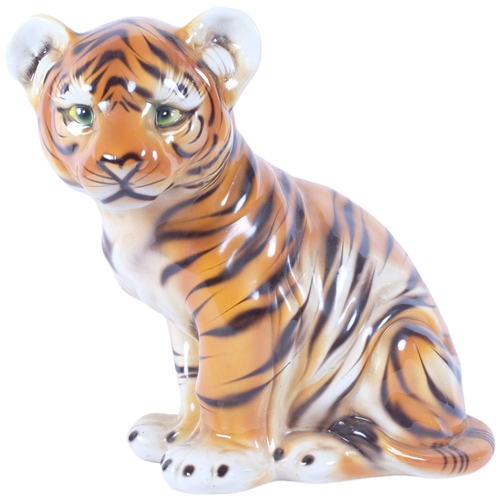 185 - An Italian ceramic study of a seated tiger cub, H33.5cm