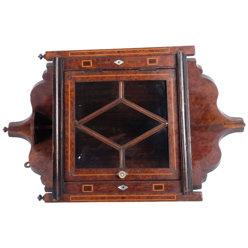 206 - A small 19th century burr-walnut hanging corner cabinet, glazed door, L51cm