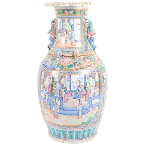 211 - A large Chinese famille rose vase, with applied dragon dog of fo decoration, 42.5cm