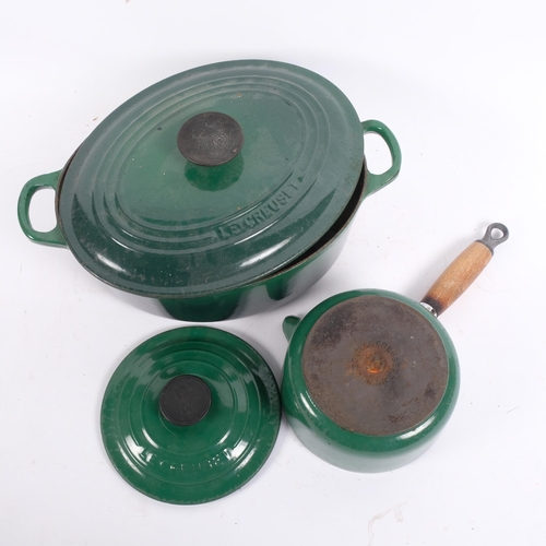 213 - A Le Creuset green enamelled 2-handled pot and cover, and matching saucepan and cover