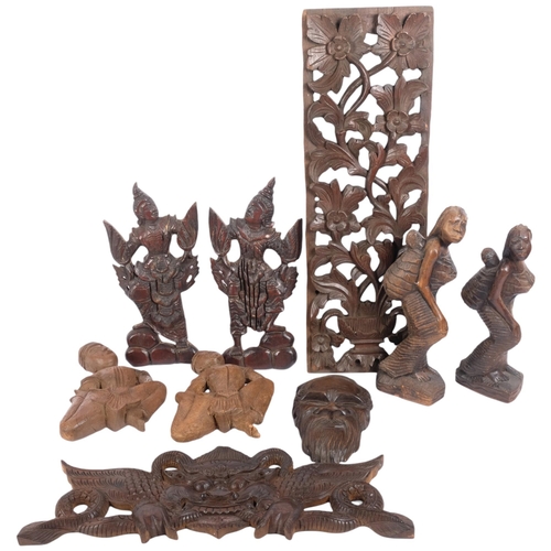 221 - A group of various African and other carved figures, Indian carved panel, etc