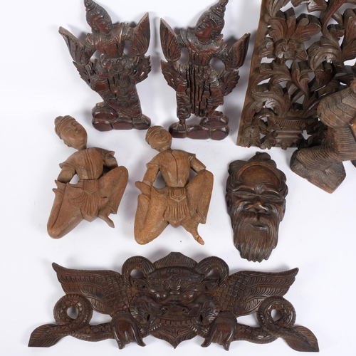 221 - A group of various African and other carved figures, Indian carved panel, etc