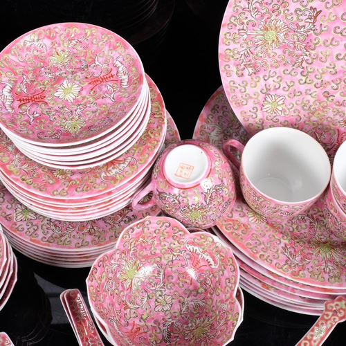 222 - An extensive Japanese pink ground dinner service for 8 people